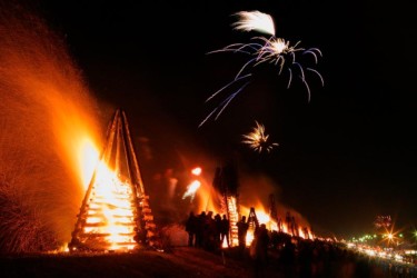 Entire Mississippi levee lined with bonfires Louisiana Christmas Eve Bonfires