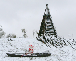 Santa snowboarding in a pirogue. Louisiana Christmas Eve Bonfires